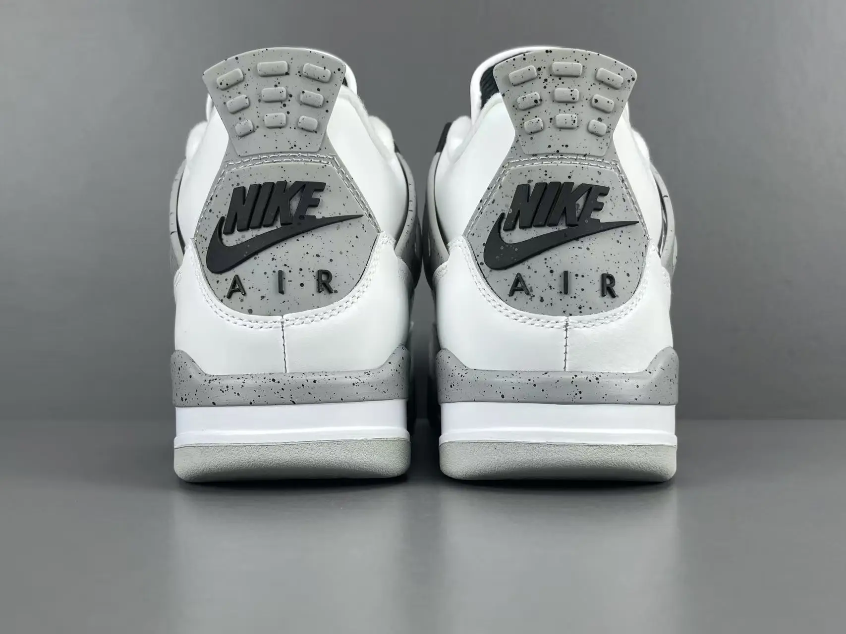 Nike Air Jordan 4 OG White Cement white gray speckled leather sneakers back view