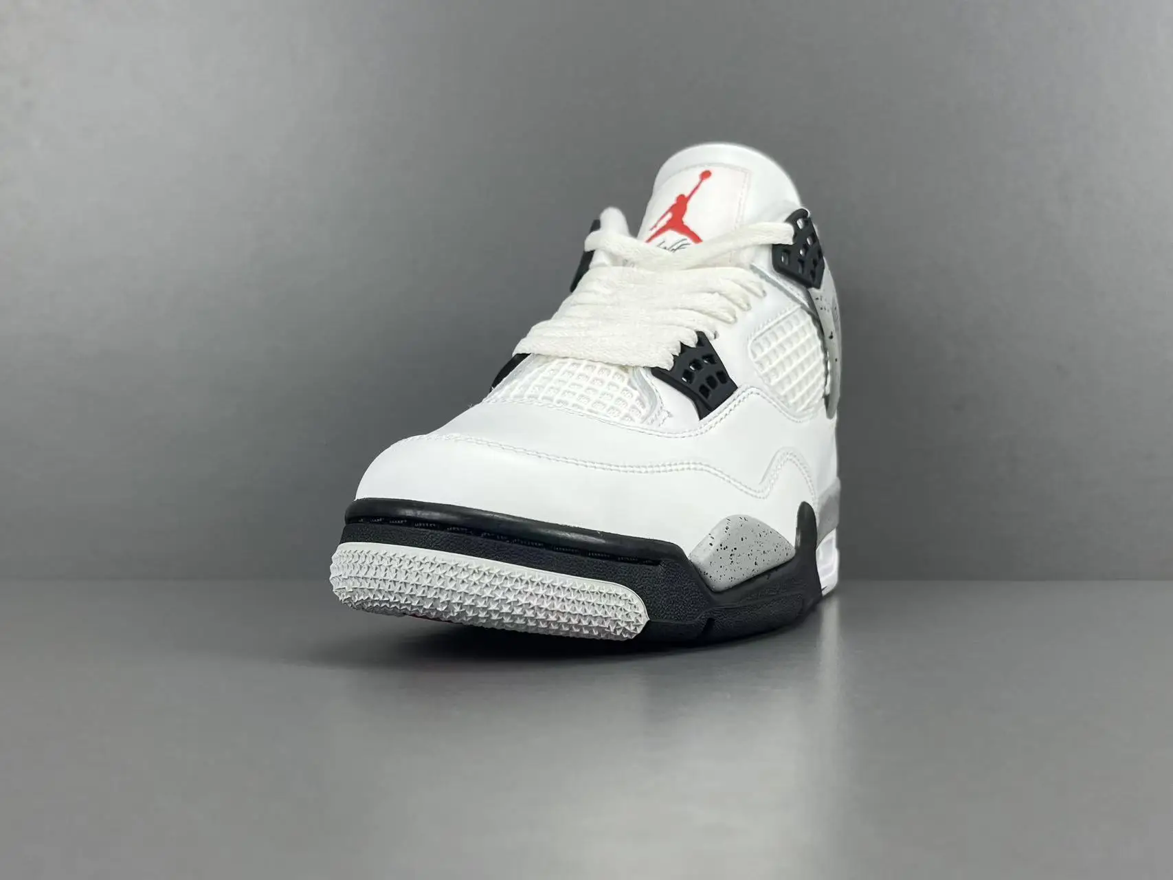 Nike Air Jordan 4 Retro white black cement gray leather sneakers with red Jumpman logo