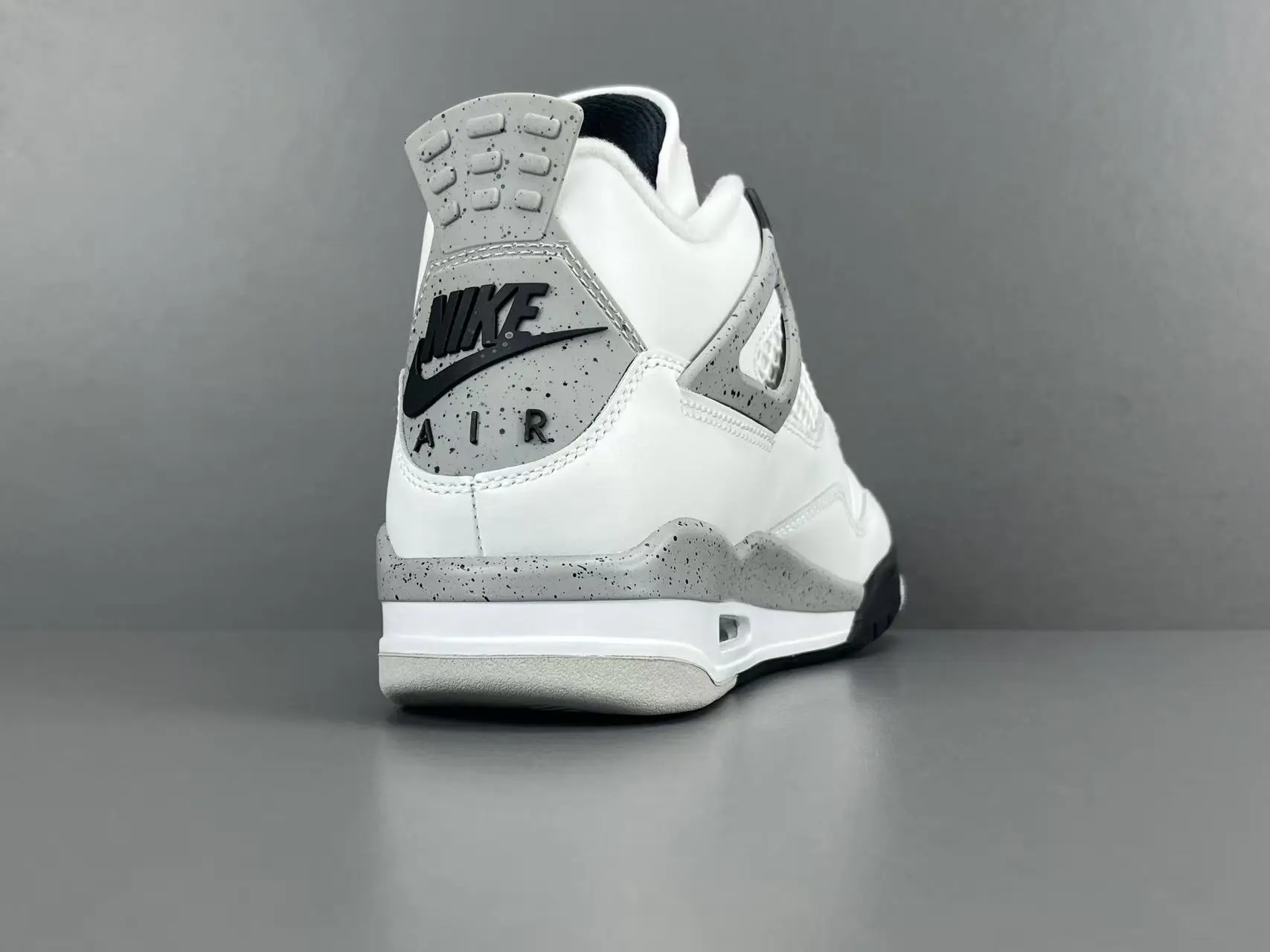 Nike Air Jordan 4 White Cement white grey black leather sneakers with speckled detailing