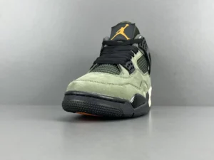 UNDEFEATED x Jordan Air Jordan 4 sneaker in green and black colorway, featuring iconic Jumpman logo and textured upper, showcased against a neutral background.