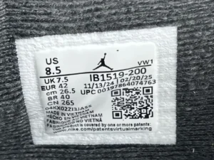 Label tag of UNDEFEATED x Jordan Air Jordan 4 sneakers showing size US 8.5, UK 7.5, and QR code for product information.