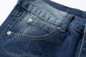 Repsgoat blue denim jeans with yellow stitching and metal rivet detail cotton material