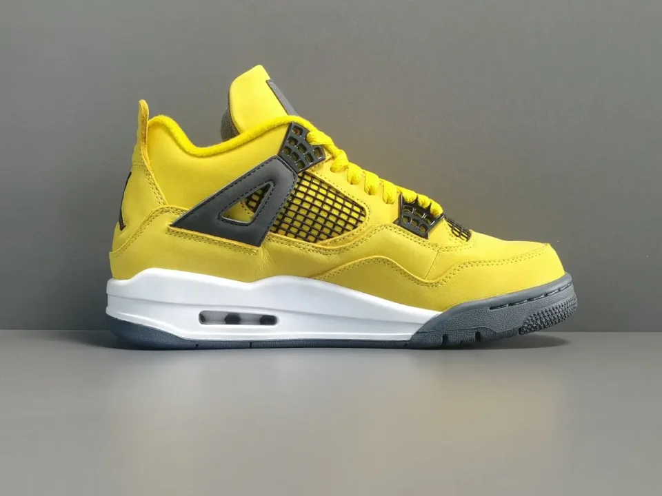 Nike Air Jordan 4 Retro Lightning yellow black white leather sneakers with rubber sole