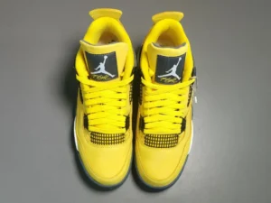 Nike Air Jordan 4 Retro Lightning yellow black leather sneakers with mesh detailing and plastic wings