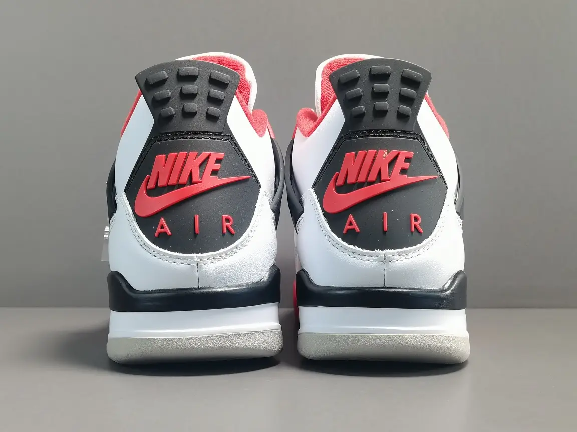 Nike Air Jordan 4 Retro fire red white black leather sneakers rear view with red Nike Air branding