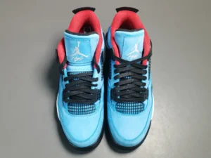 Ice Blue Travis Scott Cactus Jack x Air Jordan 4 sneakers featuring black laces, vibrant red accents, and a signature Jordan logo on the tongue.