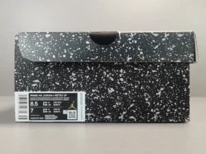 Air Jordan 4 Retro Canyon Purple sneaker box featuring a black and white speckled design with size and product information label.