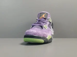 Air Jordan 4 Retro Canyon Purple sneaker featuring a vibrant purple suede upper, contrasting green outsole, and iconic Jumpman logo.