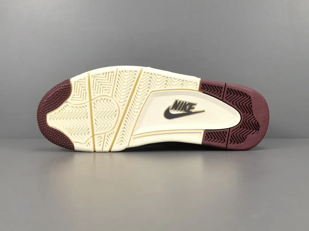 Nike Air Jordan 4 Retro SP A Ma Maniére Violet Ore sneaker outsole with maroon and cream colorway, highlighting premium craftsmanship and design features.