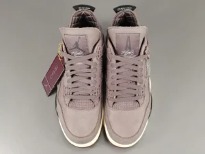 Jordan 4 Retro SP A Ma Maniére Violet Ore sneakers in gray and cream, featuring a premium design and hangtag, showcasing style and brand collaboration.