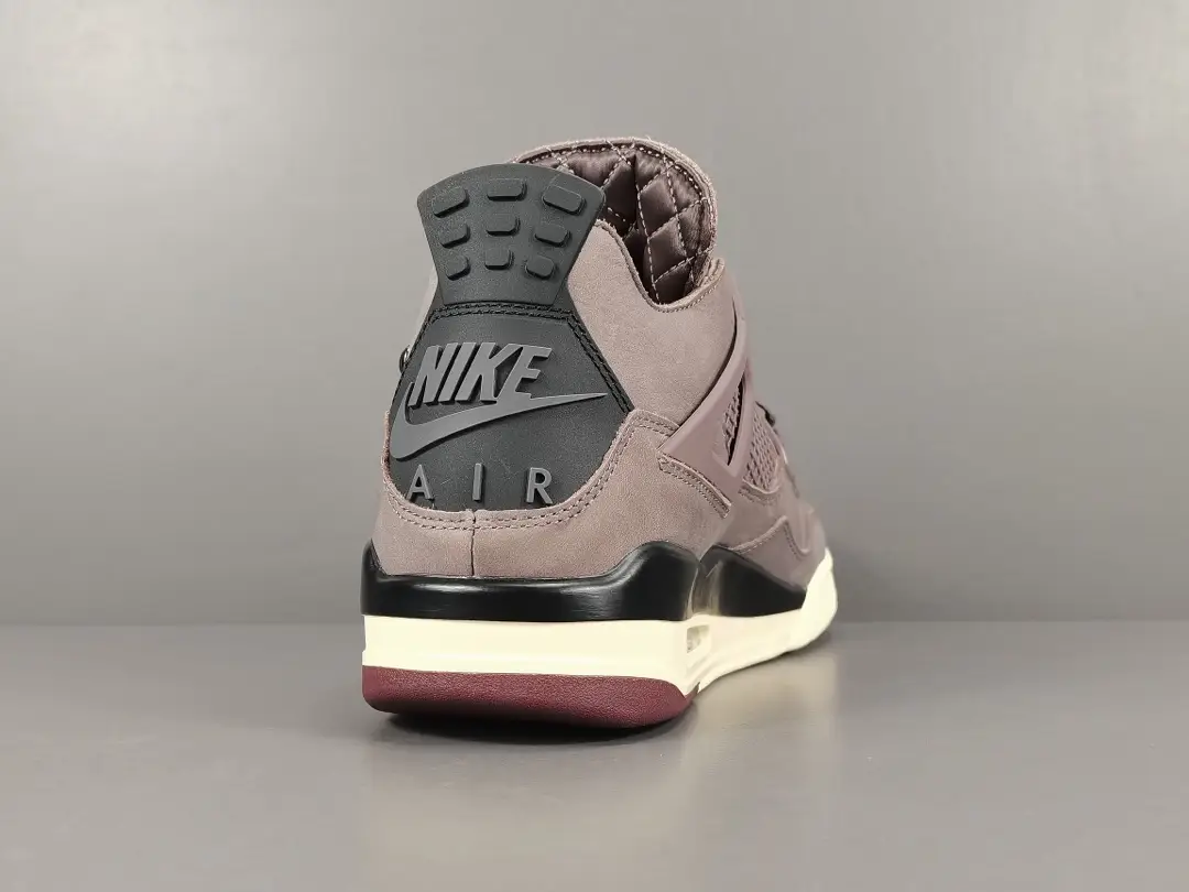 Jordan 4 Retro SP A Ma Maniére Violet Ore sneaker showcasing the rear view with prominent Nike Air branding and a soft violet colorway against a neutral background.