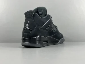 Nike Air Jordan 4 Retro Black Cat black nubuck sneakers with mesh side panels and rubber sole