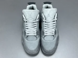 Jordan Air Jordan 4 SE Soke Gr sneakers in gray and white colorway, featuring prominent lacing and signature logo, displayed against a neutral background.