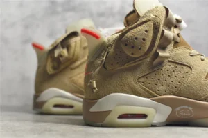 Air Jordan 6 Retro Travis Scott British Khaki sneakers featuring a tan suede upper, visible Air unit, and signature branding details.