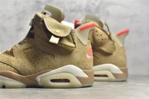 Air Jordan 6 Retro Travis Scott British Khaki sneakers featuring a suede upper in khaki, orange accents, and a distinctive design, showcasing luxury replica footwear.