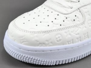 Louis Vuitton LV Trainer sneaker white embossed leather luxury design detail close-up
