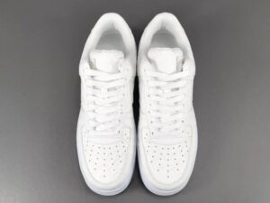 Nike Air Force 1 Low white leather sneakers with perforated toe box and classic silhouette