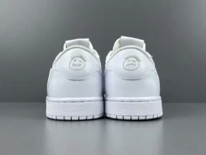 Nike Air Jordan 1 Low OG white colorway leather sneakers with embroidered smiley face logo on heel