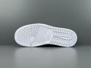 Nike Air Jordan 1 Low white outsole rubber sneakers with circular traction pattern and Nike logo embossing