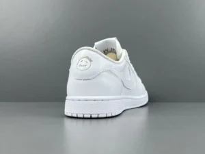 Nike Air Jordan 1 Low OG white colorway leather sneakers with embroidered heel logo and white sole