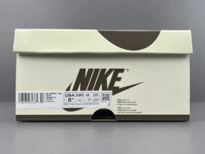 Nike shoe box featuring Travis Scott x Air Jordan 1 Low branding, size label US 8, EU 42, UK 7, with a sleek design and prominent Nike logo.