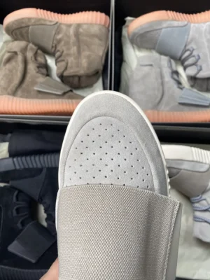 Yeezy 750 Boost Light Grey Gum Suede high-top sneakers with perforated toe and rubber sole