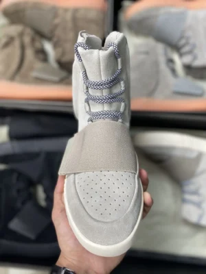 Adidas Yeezy 750 Boost light grey suede and mesh sneakers with unique midfoot strap and rope laces